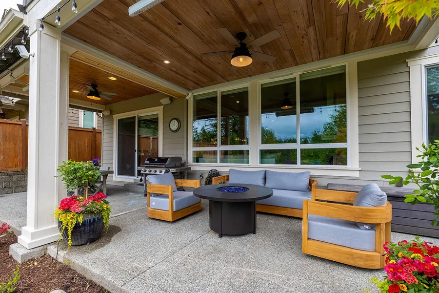 Finished outdoor living space with seating and heating